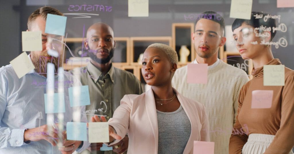 Project members discussing progress and generating ideas